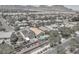 An aerial view showcases backyard pools and a home with solar panels in a well-maintained neighborhood at 1212 Anime Dr, Las Vegas, NV 89144