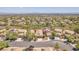 Scenic aerial view of a residential neighborhood with lush greenery and diverse housing styles at 1212 Anime Dr, Las Vegas, NV 89144