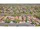 Extensive neighborhood aerial view showing a community with varied home styles, solar panels, and mature landscaping at 1212 Anime Dr, Las Vegas, NV 89144