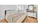 Cozy bedroom featuring a queen bed, wood floors, and ample natural light at 1212 Anime Dr, Las Vegas, NV 89144