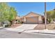 Well-maintained one-story house with desert landscaping, a spacious driveway, and an attached two-car garage at 1212 Anime Dr, Las Vegas, NV 89144
