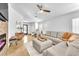 Bright living room featuring a stylish sectional sofa, modern furniture, and a cozy fireplace at 1212 Anime Dr, Las Vegas, NV 89144