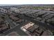 An aerial view of a single story home with a red tile roof in a suburban neighborhood at 1301 Nugget Creek Dr, Las Vegas, NV 89108