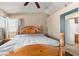 Bright bedroom with wood bedframe and ensuite bathroom access at 1301 Nugget Creek Dr, Las Vegas, NV 89108