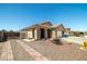 Attractive single-story home featuring desert landscaping and a decorative brick walkway at 1301 Nugget Creek Dr, Las Vegas, NV 89108