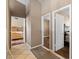 Hallway featuring tile flooring and doorways leading to various rooms at 1301 Nugget Creek Dr, Las Vegas, NV 89108
