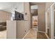 Inviting hallway with neutral walls and tile flooring leading to bedrooms at 1301 Nugget Creek Dr, Las Vegas, NV 89108