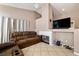 Comfortable living room featuring a fireplace and neutral tones at 1301 Nugget Creek Dr, Las Vegas, NV 89108