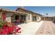 Covered patio with sliding glass door access and colorful bougainvillea at 1301 Nugget Creek Dr, Las Vegas, NV 89108