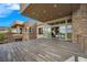 Spacious covered outdoor patio with stone exterior at 1472 Macdonald Ranch Dr, Henderson, NV 89012