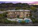 Expansive backyard featuring a pool, hot tub, fire pit, and ample seating for entertaining at 1472 Macdonald Ranch Dr, Henderson, NV 89012