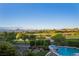 A manicured backyard overlooks a golf course and city views at 1472 Macdonald Ranch Dr, Henderson, NV 89012