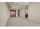 Neutral bedroom has carpet and walk in closet with an adjacent bathroom at 1472 Macdonald Ranch Dr, Henderson, NV 89012
