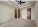 Neutral bedroom featuring a ceiling fan and ensuite doors at 1472 Macdonald Ranch Dr, Henderson, NV 89012