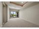 Carpeted bedroom with glass sliding doors with backyard views, recessed lights, and ceiling fan at 1472 Macdonald Ranch Dr, Henderson, NV 89012