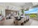Bright dining area with stone fireplace, scenic views, and seating for eight at 1472 Macdonald Ranch Dr, Henderson, NV 89012