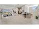 Spacious foyer featuring neutral decor, tile flooring, and views of the living room at 1472 Macdonald Ranch Dr, Henderson, NV 89012