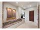 Inviting hallway featuring a unique stone water feature and neutral decor at 1472 Macdonald Ranch Dr, Henderson, NV 89012
