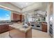 Modern kitchen with stainless steel appliances, granite countertops, and a breakfast bar at 1472 Macdonald Ranch Dr, Henderson, NV 89012