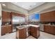 Gourmet kitchen featuring stainless steel appliances, granite countertops, and a large island at 1472 Macdonald Ranch Dr, Henderson, NV 89012