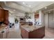 Gourmet kitchen featuring a center island, granite countertops, and stainless steel appliances at 1472 Macdonald Ranch Dr, Henderson, NV 89012
