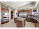 Gourmet kitchen featuring stainless steel appliances, granite countertops, and a large island at 1472 Macdonald Ranch Dr, Henderson, NV 89012