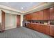 Entertainment room with dark wood cabinets and beverage cooler at 1472 Macdonald Ranch Dr, Henderson, NV 89012