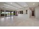 Spacious living room with access to the outside patio, built-in bar area, and recessed lighting at 1472 Macdonald Ranch Dr, Henderson, NV 89012