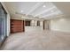 Open-plan living area featuring tile flooring, recessed lighting, and a built-in bar area for entertaining at 1472 Macdonald Ranch Dr, Henderson, NV 89012