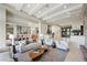 Spacious living room featuring high ceilings, designer furniture, and elegant decor at 1472 Macdonald Ranch Dr, Henderson, NV 89012