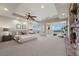 Spacious main bedroom with fireplace, seating area, and ample natural light at 1472 Macdonald Ranch Dr, Henderson, NV 89012