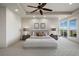 Bright main bedroom with a ceiling fan, neutral colors, and plenty of space at 1472 Macdonald Ranch Dr, Henderson, NV 89012
