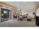 In-home movie theater including tiered leather seating and projector screen at 1472 Macdonald Ranch Dr, Henderson, NV 89012