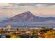 Scenic mountain views overlooking the city from this property's location, nestled among lush greenery at 1472 Macdonald Ranch Dr, Henderson, NV 89012