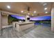 Spacious outdoor kitchen featuring stainless steel appliances and a beautiful countertop with pool view at 1472 Macdonald Ranch Dr, Henderson, NV 89012