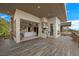 An outdoor entertainment patio features a built in kitchen and access to the living area at 1472 Macdonald Ranch Dr, Henderson, NV 89012