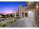 Enjoy outdoor living with a stone column patio, fire pit, and scenic views at 1472 Macdonald Ranch Dr, Henderson, NV 89012