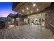 An open-air patio features stone accents, open living spaces and railing views at 1472 Macdonald Ranch Dr, Henderson, NV 89012