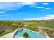 Stunning pool with spa and golf course views, surrounded by lush landscaping and privacy at 1472 Macdonald Ranch Dr, Henderson, NV 89012