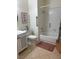 Bright bathroom featuring a tub with shower, and tiled flooring at 1851 Hillpointe Rd # 2621, Henderson, NV 89074