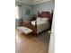 Comfortable bedroom featuring a wooden bed frame and neutral decor at 1851 Hillpointe Rd # 2621, Henderson, NV 89074