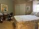 Bedroom featuring a bed, closet, and desk area illuminated by a window at 1851 Hillpointe Rd # 2621, Henderson, NV 89074
