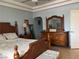 Bright bedroom with light blue walls, dresser and a wooden bed frame at 1851 Hillpointe Rd # 2621, Henderson, NV 89074