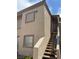 Two-story condo exterior with stairs leading to the upper level entry at 1851 Hillpointe Rd # 2621, Henderson, NV 89074