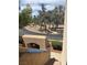 Exterior view from the top of outdoor stairs, showing landscaping and the parking area at 1851 Hillpointe Rd # 2621, Henderson, NV 89074