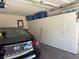 Organized garage featuring built in cabinets, and a black Hyundai sedan at 1851 Hillpointe Rd # 2621, Henderson, NV 89074