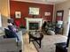 Comfortable living room featuring a fireplace, and hardwood floors at 1851 Hillpointe Rd # 2621, Henderson, NV 89074