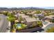 Aerial perspective showcasing well-kept homes, lush greenery, a private pool, and a serene neighborhood street at 2434 Amoretti St, Henderson, NV 89052