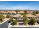 Aerial view of a charming neighborhood, showcasing well-maintained homes with beautiful landscaping and desert views at 2434 Amoretti St, Henderson, NV 89052