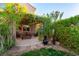 Beautiful backyard with a cozy pergola-covered patio and lush greenery for privacy and relaxation at 2434 Amoretti St, Henderson, NV 89052